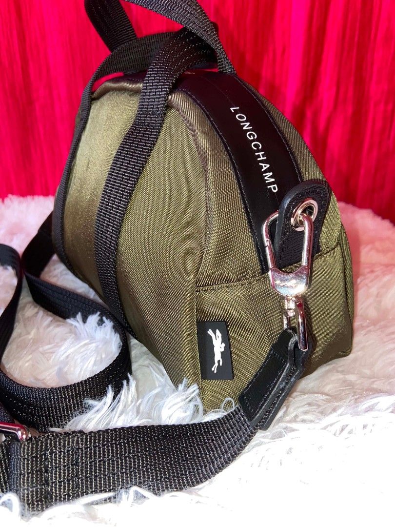Longchamp Le Pliage Energy Bowling Bag (Category: Cross-body Bags) located in Bulacan. Submitted by bella.ken.varietystore (Listing ID 1462176714, Image 3). Description: Design details • Colour: Khaki • Canvas material made with recycled fibres • Leather trims • Silver‑tone hardware • Zip closure • Adjustable and removable strap • Two flat interior pockets.