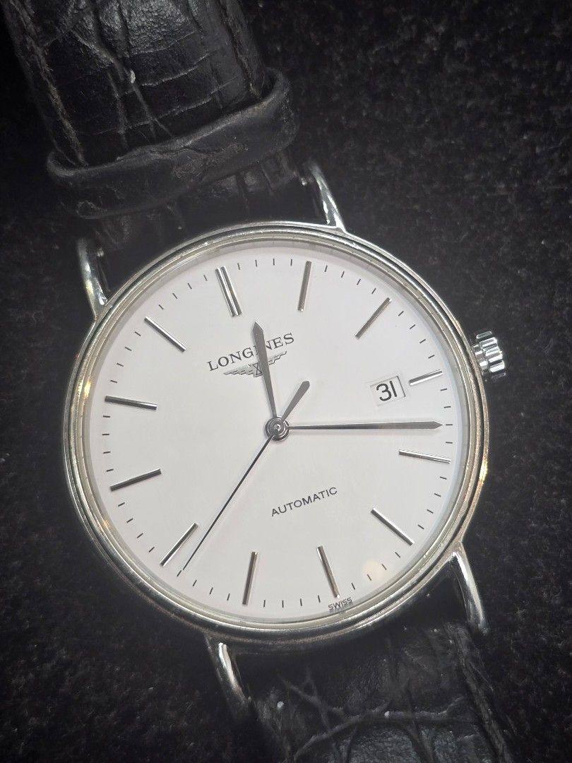 Longines Presence White Dial Automatic Men's Watch (Category: Luxury Watches) located in Taguig. Submitted by mluxeph (Listing ID 1462083719, Image 1). Description: Longines Presence White Dial Men's Watch Reference #: L4.921.4 Movement: Automatic Case Size: 38mm Case Material: Stainless Steel Strap Size: 5.8 inches Crystal: Sapphire Dial Type/Color: Analog/White Water Resistance: 30m Calendar: Date Display Band Type: Strap Band Material: Leather