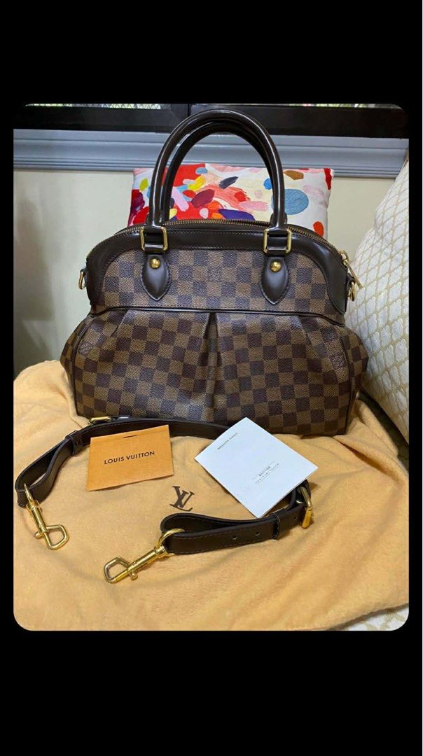 Louis Vuitton Damier Ebene Trevi (Category: Luxury Bags & Wallets) located in Pasig City. Submitted by viktonline (Listing ID 1462087015, Image 1). Description: - Detachable shoulder strap included - Comes with dust bag, box, and care booklet - Ideal for everyday use and travel.