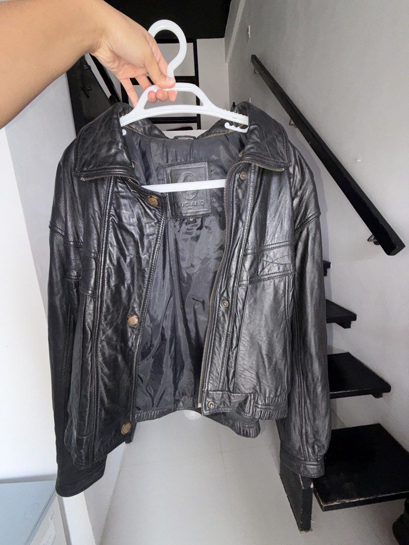 Luciano Black Leather Jacket (Category: Coats, Jackets and Outerwear) located in Baguio. Submitted by declutterain (Listing ID 1462063112, Image 2). Description: - Classic black leather jacket from Luciano - Size: Medium (M) - Features zip-up front with button closures - Two front pockets with button details - Snap closure on the collar - Versatile for layering or standalone wear - A timeless wardrobe essential.