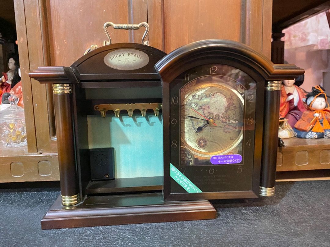 Lucky Stage Wooden Desk Clock with World Map (Category: Clocks) located in Manila. Submitted by waltdisney10 (Listing ID 1462035911, Image 1). Description: - Wooden desk clock with a unique world map design. - Features a convenient small compartment with hooks. - 'Lucky Stage' logo adds a touch of branding. - Ideal for study rooms, home offices, or any workspace. - Adds a decorative and functional element to your desk..