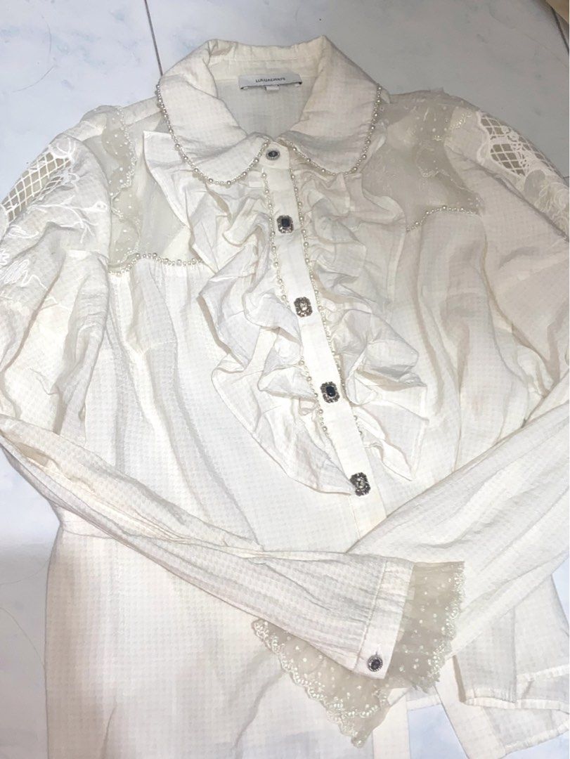 LULUALWAYS Designer Cream Ruffle & Lace Blouse (Category: Longsleeves) located in Quezon City. Submitted by choiyiee14 (Listing ID 1462115752, Image 1). Description: Medium Tag - never been used 📍Quezon City | GCash | Lalamove or J&T Courier.