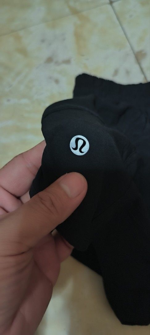 Lululemon Black Shorts Size 2 (Category: Activewear) located in Manila. Submitted by itsmelawrence (Listing ID 1462204541, Image 2). Description: - Brand: Lululemon - Color: Black - Size: 2 - Made in: Bangladesh - Fabric Composition: 86% recycled polyester, 14% elastane (body) - Inner Waistband: 87% nylon, 13% Lycra elastane - Liner: 89% polyester, 11% elastane - Features: Zippered pocket for secure storage.