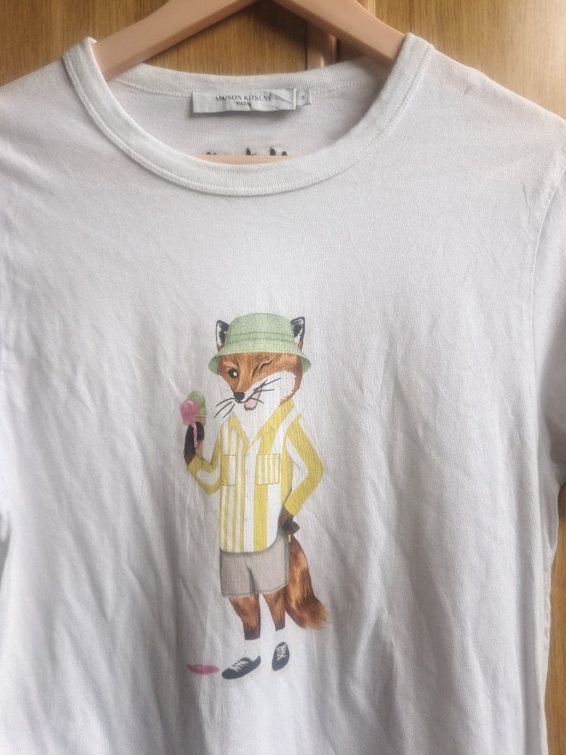 Maison Kitsune Shirt (Category: Tshirts & Polo Shirts ) located in Davao. Submitted by affordathriftph_ (Listing ID 1462089179, Image 2). Description: Excellent / sign of usage only no crack on prints no holes or rips Small size 19" W 25" L Message interested buyer only, thank you.