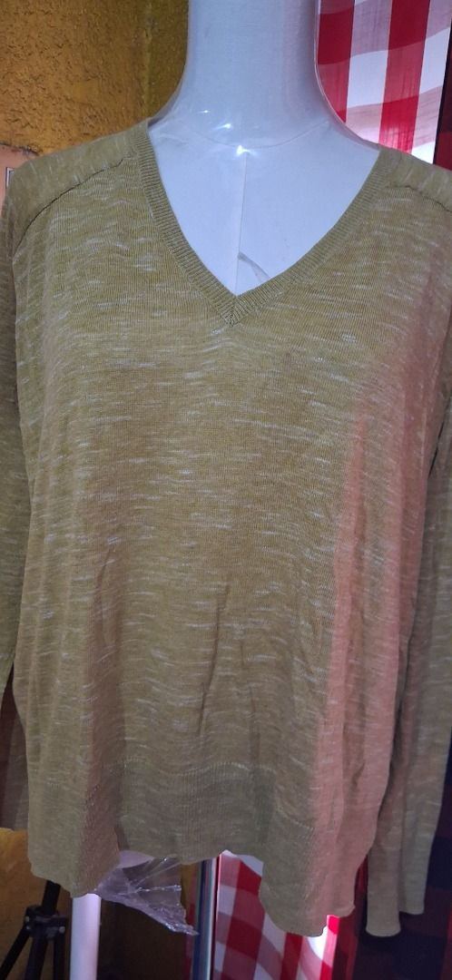 Mango Basics Khaki yellow V-Neck T-Shirt (Category: Shirts) located in Manila. Submitted by katkween23 (Listing ID 1462086870, Image 2). Description: - Brand: Mango - Style: V-neck T-shirt - Color: Khaki - Sleeves: Long sleeves - Fabric: Lightweight, textured - Fit: Size XS - Features: Great for layering or wearing on its own.