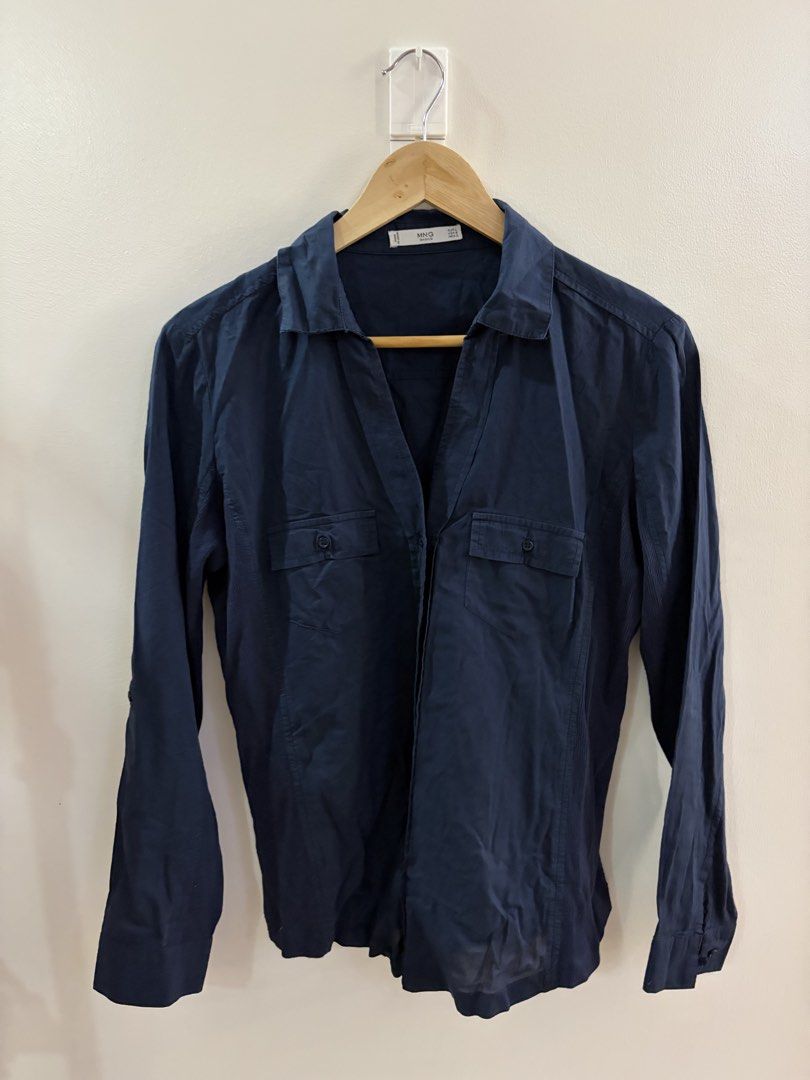 Mango Basics Navy Blue Long Sleeve Shirt (Category: Longsleeves) located in San Juan City. Submitted by sel.ler (Listing ID 1462126832, Image 1). Description: - Navy blue long sleeve shirt from MNG Basics - Button-up front with two chest pockets - Collared neckline - Made in India - Versatile for casual or work attire.