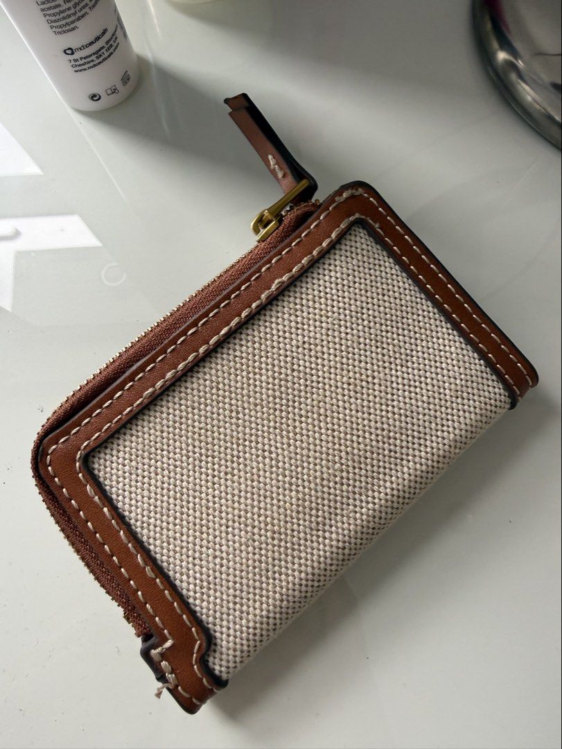 MANGO Canvas and Leather Bifold Wallet (Category: Wallets & Card holders) located in Manila. Submitted by smrev224 (Listing ID 1462053065, Image 3). Description: - Cute bifold wallet from MANGO - Canvas front with brown leather trim - Interior card slots - Secure snap closure - Zip-around closure for extra security - Ideal for keeping essentials organized.