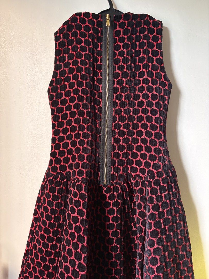 Marc Jacobs Textured Pattern Flare Dress (Category: Dresses) located in Las Pinas. Submitted by bibliomomma (Listing ID 1462094442, Image 3). Description: Marc Jacobs black and red sleeveless dress featuring a textured geometric pattern, fitted bodice, and flared pleated skirt. Zip closure at the back. Stylish statement piece, perfect for parties or special occasions When laid flat Pit to pit 15.5 inches Length 32 inches MOP Gcash.
