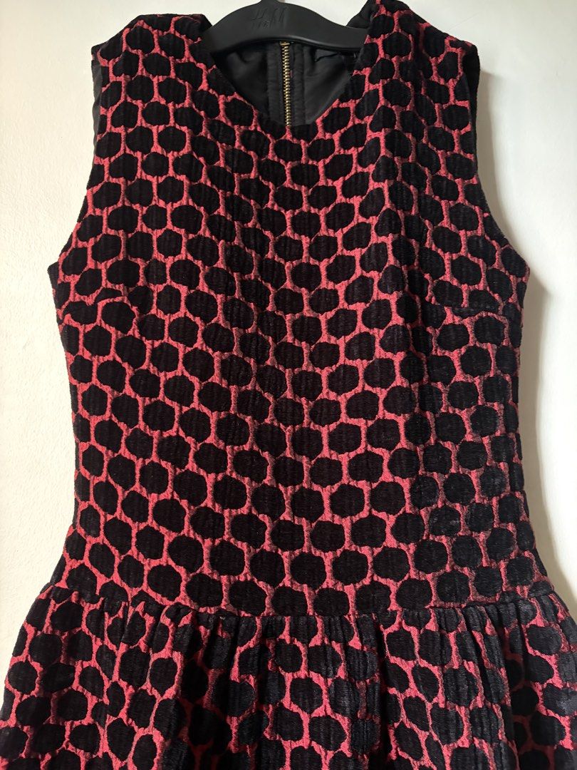 Marc Jacobs Textured Pattern Flare Dress (Category: Dresses) located in Las Pinas. Submitted by bibliomomma (Listing ID 1462094442, Image 2). Description: Marc Jacobs black and red sleeveless dress featuring a textured geometric pattern, fitted bodice, and flared pleated skirt. Zip closure at the back. Stylish statement piece, perfect for parties or special occasions When laid flat Pit to pit 15.5 inches Length 32 inches MOP Gcash.