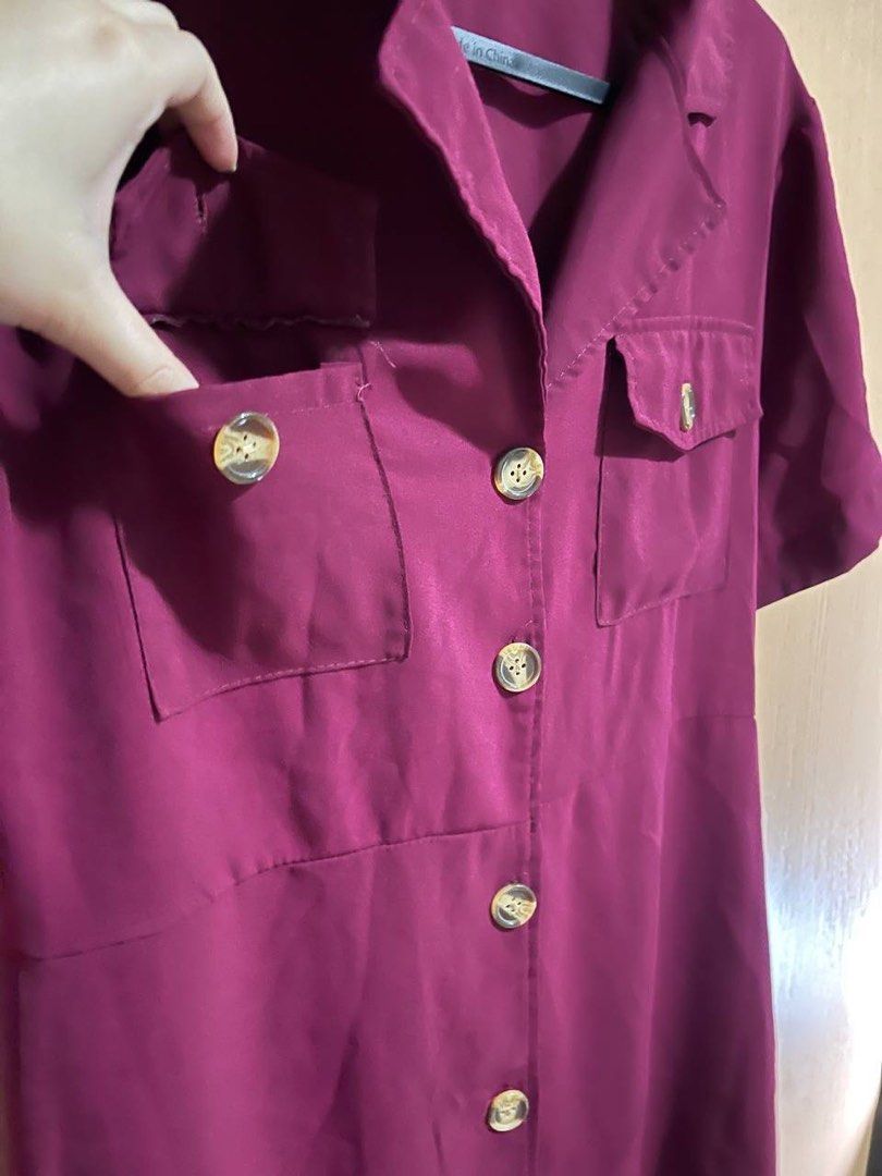Maroon Button-Up Shirt Dress with Pockets (Category: Dresses) located in Manila. Submitted by maichandise (Listing ID 1462145519, Image 3). Description: - Maroon shirt dress - Short sleeves - Collared neckline - Two chest pockets with button details - Button-up front - Knee-length - Versatile for casual or dressed-up occasions Item is preloved 🥰.