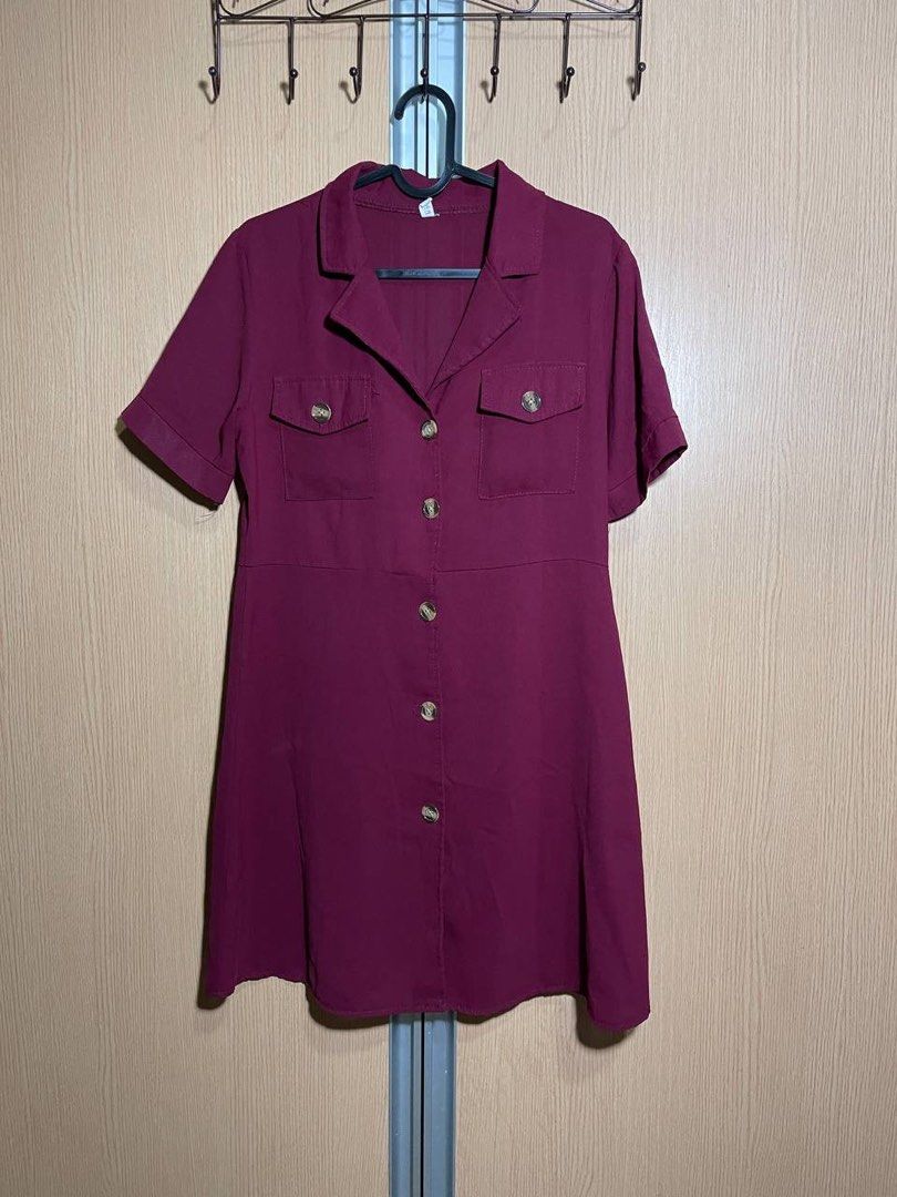 Maroon Button-Up Shirt Dress with Pockets (Category: Dresses) located in Manila. Submitted by maichandise (Listing ID 1462145519, Image 1). Description: - Maroon shirt dress - Short sleeves - Collared neckline - Two chest pockets with button details - Button-up front - Knee-length - Versatile for casual or dressed-up occasions Item is preloved 🥰.