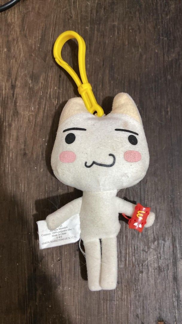 McDonald's toro inoue Plush Keychain (Category: Plushies & Soft Toys) located in Davao. Submitted by aegyochan (Listing ID 1462118858, Image 1). Description: - Adorable white cat plush keychain. - Features a secure yellow clip for easy attachment. - Comes with a cute mini McDonald's accessory. - Made from 100% polyester fiber. - Perfect for bags, backpacks, or keys..