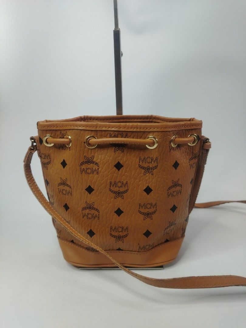 MCM cognac Visetos monogram bucket bag (Category: Shoulder Bags) located in San Carlos. Submitted by fashiondesancarlos05 (Listing ID 1462090217, Image 2). Description: Needs cleaning Needs restoration.