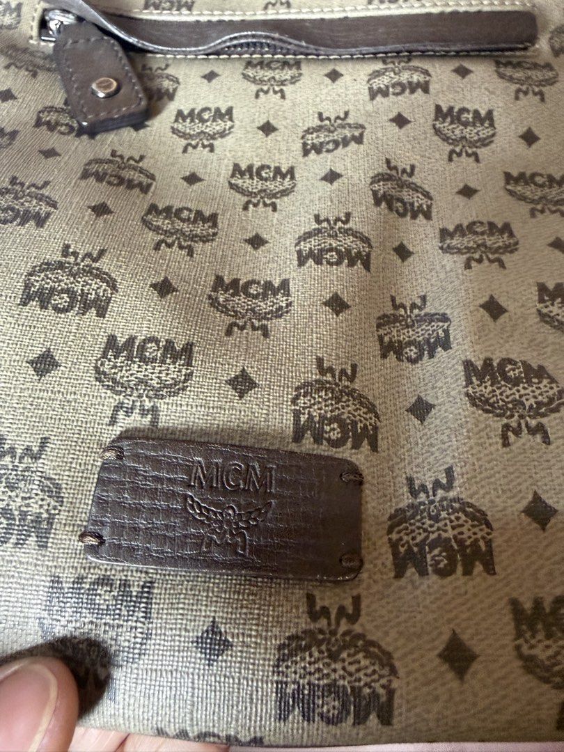 MCM Monogram Crossbody Bag (Category: Luxury Bags & Wallets) located in Manila. Submitted by izzycollections (Listing ID 1462049578, Image 2). Description: - Authentic MCM crossbody bag - Classic MCM monogram pattern - Front zippered pocket - Adjustable strap for comfortable wear - Leather trim and details - Ideal for everyday use - Needs repair onn both left and right bottom pipings.