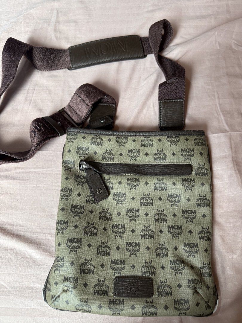 MCM Monogram Crossbody Bag (Category: Luxury Bags & Wallets) located in Manila. Submitted by izzycollections (Listing ID 1462049578, Image 1). Description: - Authentic MCM crossbody bag - Classic MCM monogram pattern - Front zippered pocket - Adjustable strap for comfortable wear - Leather trim and details - Ideal for everyday use - Needs repair onn both left and right bottom pipings.
