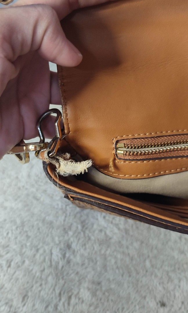 MCM Monogrammed Leather Chain Shoulder Bag (Category: Luxury Bags & Wallets) located in Pasig City. Submitted by xcess_baggage (Listing ID 1461822802, Image 3). Description: - Authentic MCM monogrammed leather shoulder bag - Classic design with gold-tone hardware - Signature MCM clasp - Detachable chain strap - Interior zipper pocket - Note: Some wear on the strap attachment point.