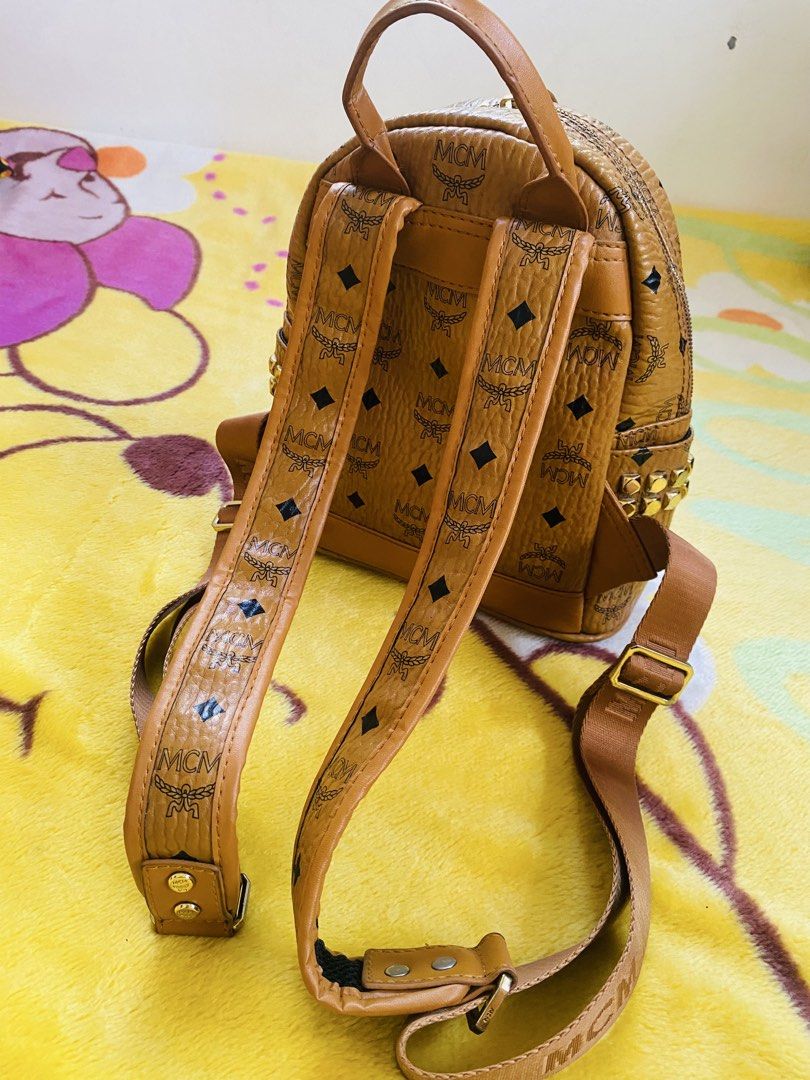MCM Mini Backpack (Category: Backpacks) located in San Jose del Monte. Submitted by cityhanter007 (Listing ID 1462061409, Image 2). Description: - MCM backpack - Gold stud details on the sides with minimal fadings - Adjustable straps - Zipper closure - Small front pocket .
