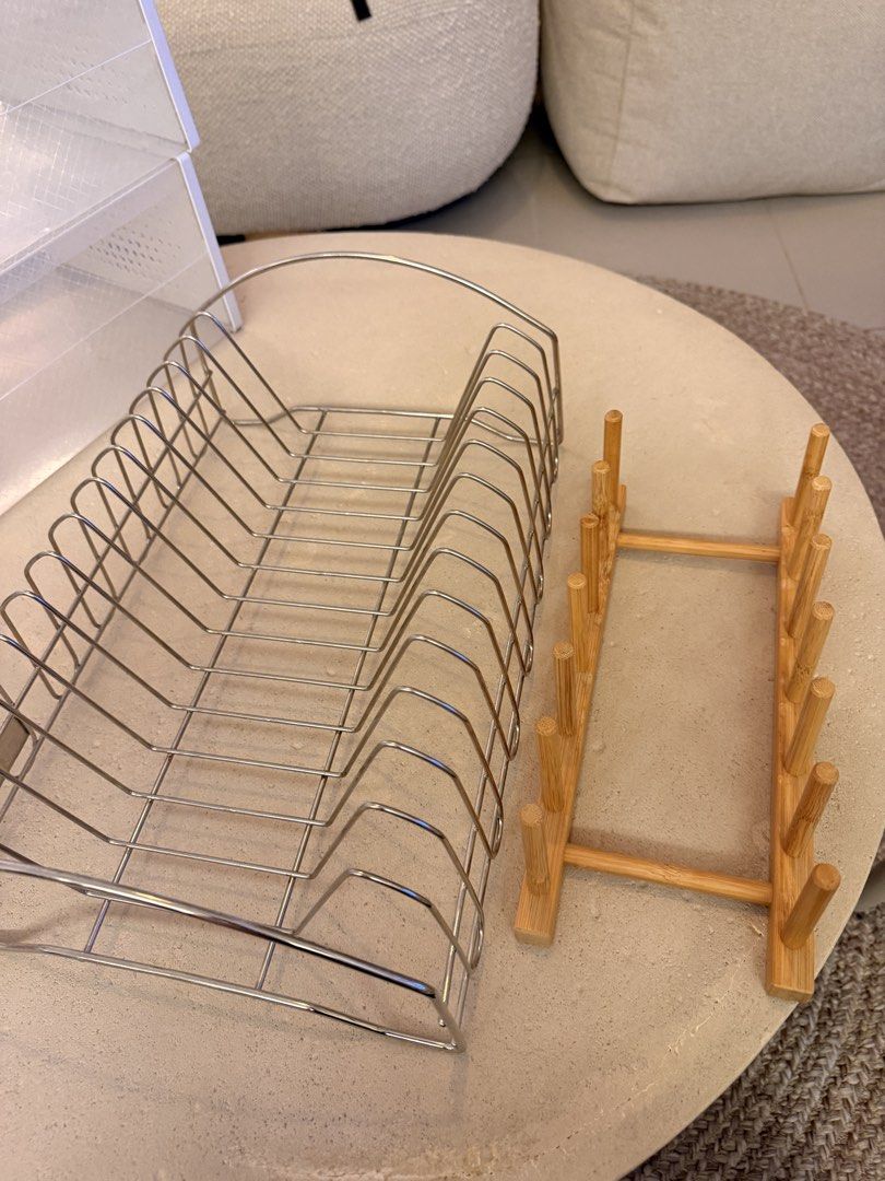 Metal Dish Rack and Bamboo Plate Stand Set (Category: Other Kitchenware & Tableware) located in Taguig. Submitted by sourcedbym (Listing ID 1462172379, Image 1). Description: - Metal dish rack with multiple slots for efficient drying. - Bamboo plate stand with pegs to hold plates upright. - Ideal for kitchen counter organization and dish drying. - Both items are in good, pre-loved condition..