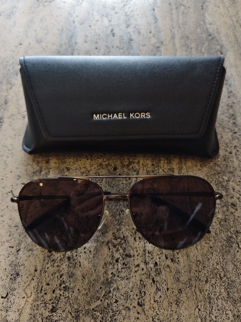 Michael Kors aviator brown sunglasses shades (Category: Sunglasses & Eyewear) located in Mandaluyong City. Submitted by lovelabelsph (Listing ID 1462221966, Image 1). Description: Michael Kors brown aviator sunglasses Php1,200 Price is firm Free shipping Model 123573 60x16 New with case (no dust cloth) MOP Gcash, BPI or BDO More items at IG lovelabelsph .
