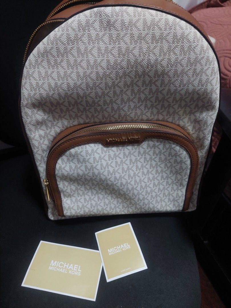 Michael Kors Backpack (Category: Backpacks) located in Valenzuela. Submitted by joliyanaa (Listing ID 1462183957, Image 1). Description: - Authentic Michael Kors Jaycee Backpack - Color: Vanilla - Signature MK logo print all over - Genuine leather trim - Gold hardware - Multiple zip compartments for ample storage - Comes with authenticity cards - Original Retail Price: $558 -Brand New.