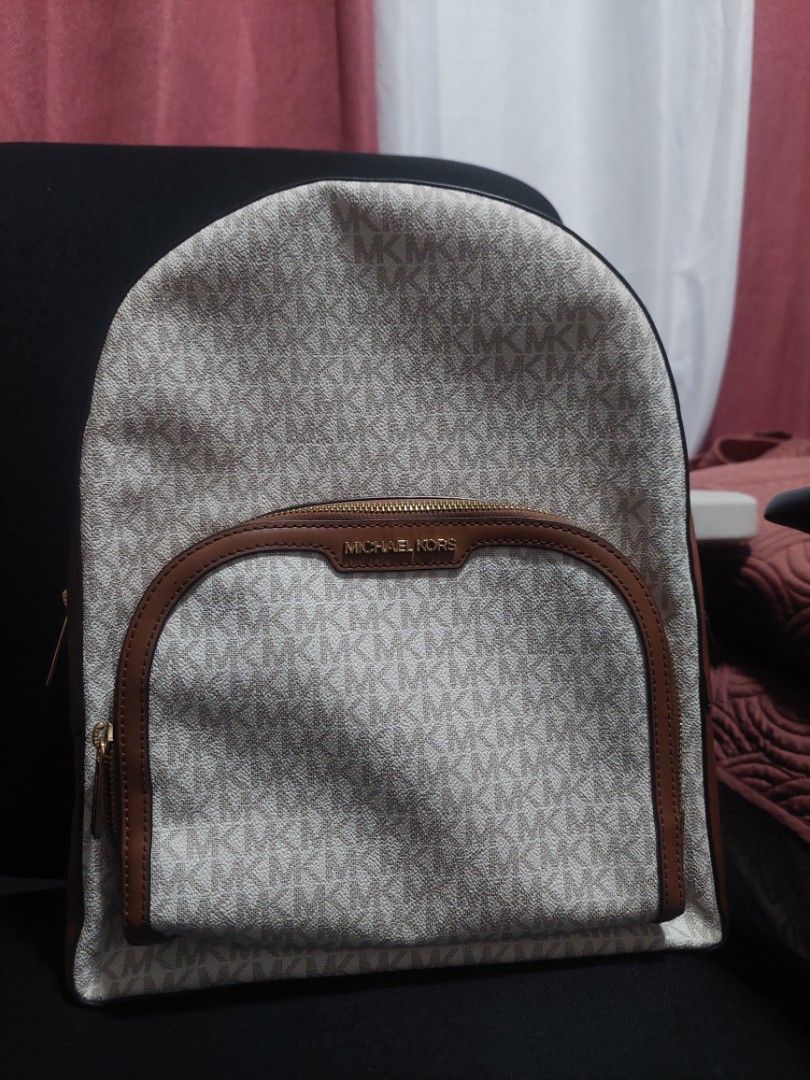 Michael Kors Backpack (Category: Backpacks) located in Valenzuela. Submitted by joliyanaa (Listing ID 1462183957, Image 2). Description: - Authentic Michael Kors Jaycee Backpack - Color: Vanilla - Signature MK logo print all over - Genuine leather trim - Gold hardware - Multiple zip compartments for ample storage - Comes with authenticity cards - Original Retail Price: $558 -Brand New.