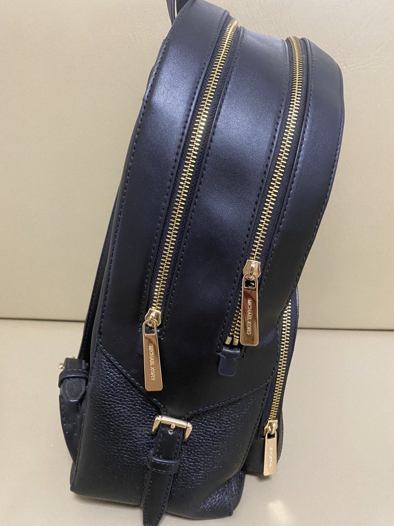 Michael Kors Black Leather Backpack (Category: Backpacks) located in Agdangan. Submitted by aikara683 (Listing ID 1462054476, Image 3). Description: - Authentic Michael Kors black leather backpack - Elegant gold hardware and zippers - Multiple zippered compartments for organized storage - Adjustable shoulder straps for a comfortable fit - Classic and versatile design, ideal for everyday or travel.