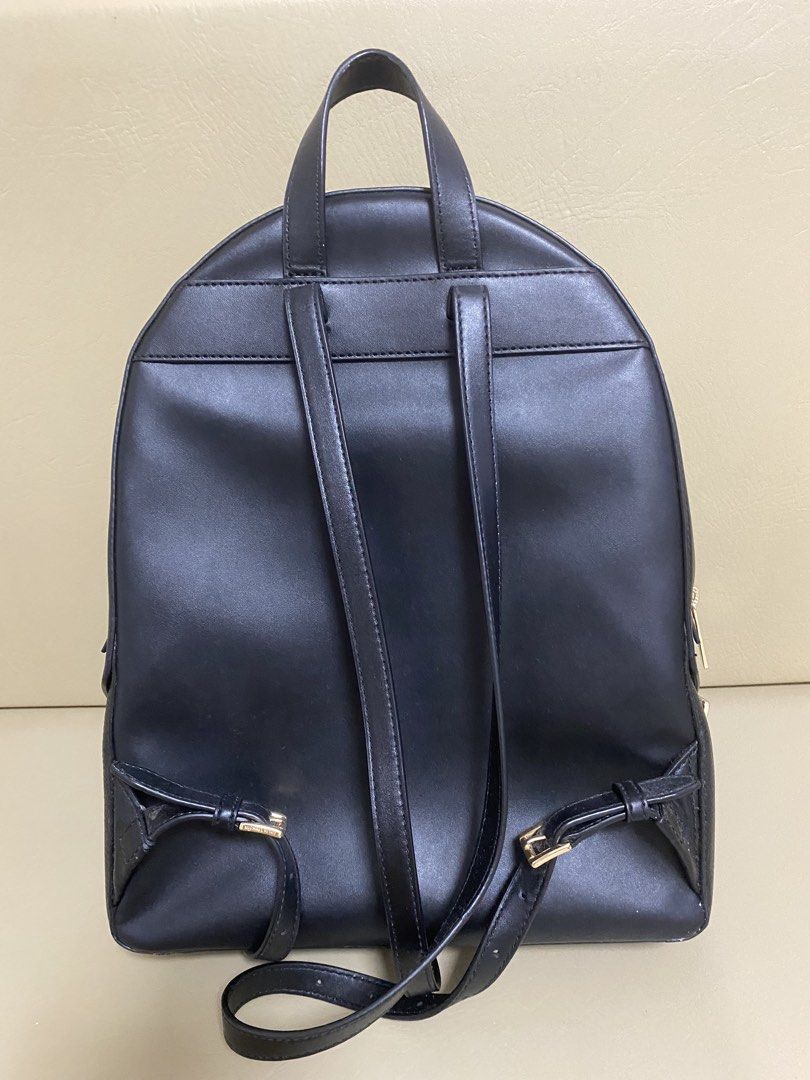 Michael Kors Black Leather Backpack (Category: Backpacks) located in Agdangan. Submitted by aikara683 (Listing ID 1462054476, Image 2). Description: - Authentic Michael Kors black leather backpack - Elegant gold hardware and zippers - Multiple zippered compartments for organized storage - Adjustable shoulder straps for a comfortable fit - Classic and versatile design, ideal for everyday or travel.