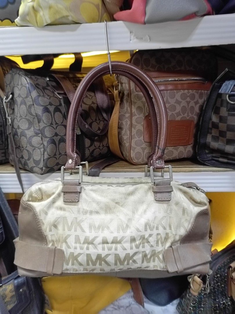 Michael Kors Monogram Canvas Leather Trimmed Handbag (Category: Luxury Bags & Wallets) located in Manila. Submitted by del_thrifts03 (Listing ID 1462079400, Image 1). Description: - Michael Kors monogram canvas handbag - Brown leather trim and handles - Zipper closure - Signs of wear on leather and hardware - Clean interior - Great everyday bag.