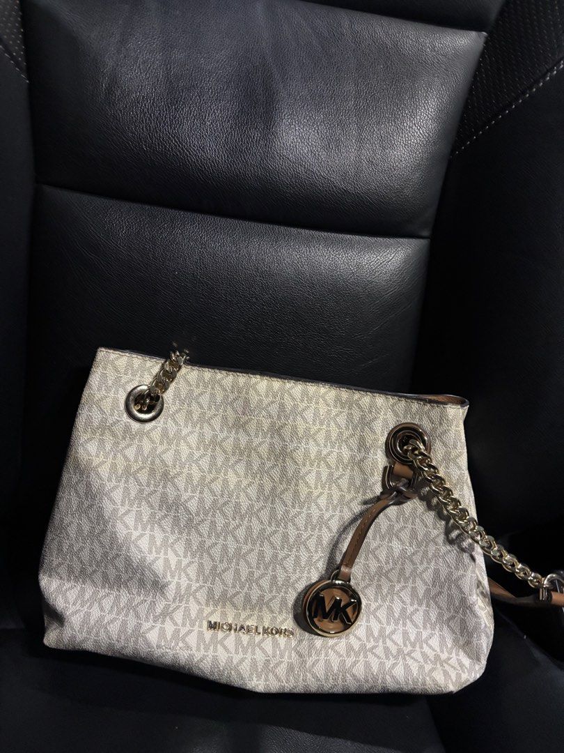 Michael Kors Monogram Shoulder Bag (Category: Luxury Bags & Wallets) located in Quezon City. Submitted by declutter.ph4 (Listing ID 1462174642, Image 1). Description: - Authentic Michael Kors shoulder bag - From US - With care card - Lightly used (with minimal discolorations only).