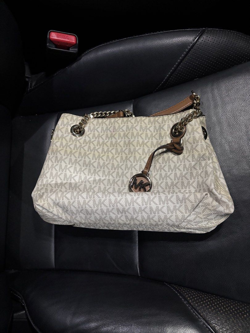 Michael Kors Monogram Shoulder Bag (Category: Luxury Bags & Wallets) located in Quezon City. Submitted by declutter.ph4 (Listing ID 1462174642, Image 2). Description: - Authentic Michael Kors shoulder bag - From US - With care card - Lightly used (with minimal discolorations only).