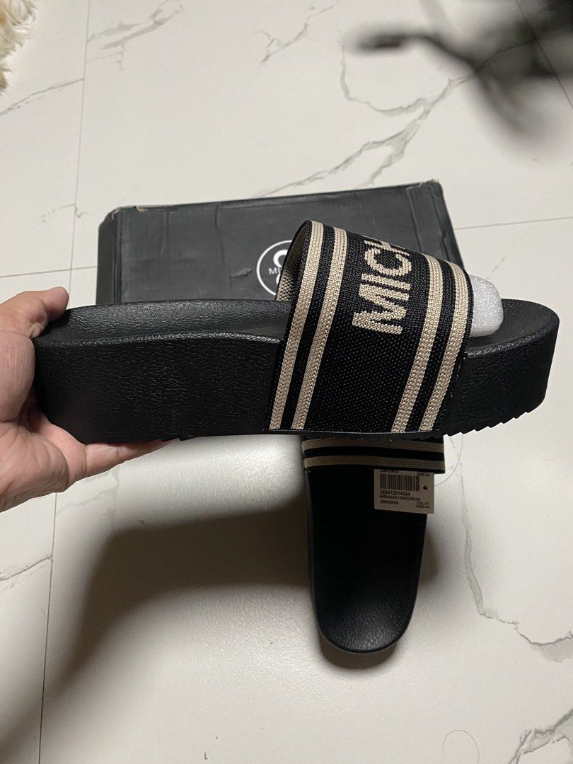 MICHAELA Black Slides with Logo Strap (Category: Slippers and slides) located in Balagtas. Submitted by dadalalashop (Listing ID 1462200106, Image 3). Description: - MICHAELA black slides - Size 40 - Features logo strap - Beige and black striped strap detail - Platform sole - Includes original box.