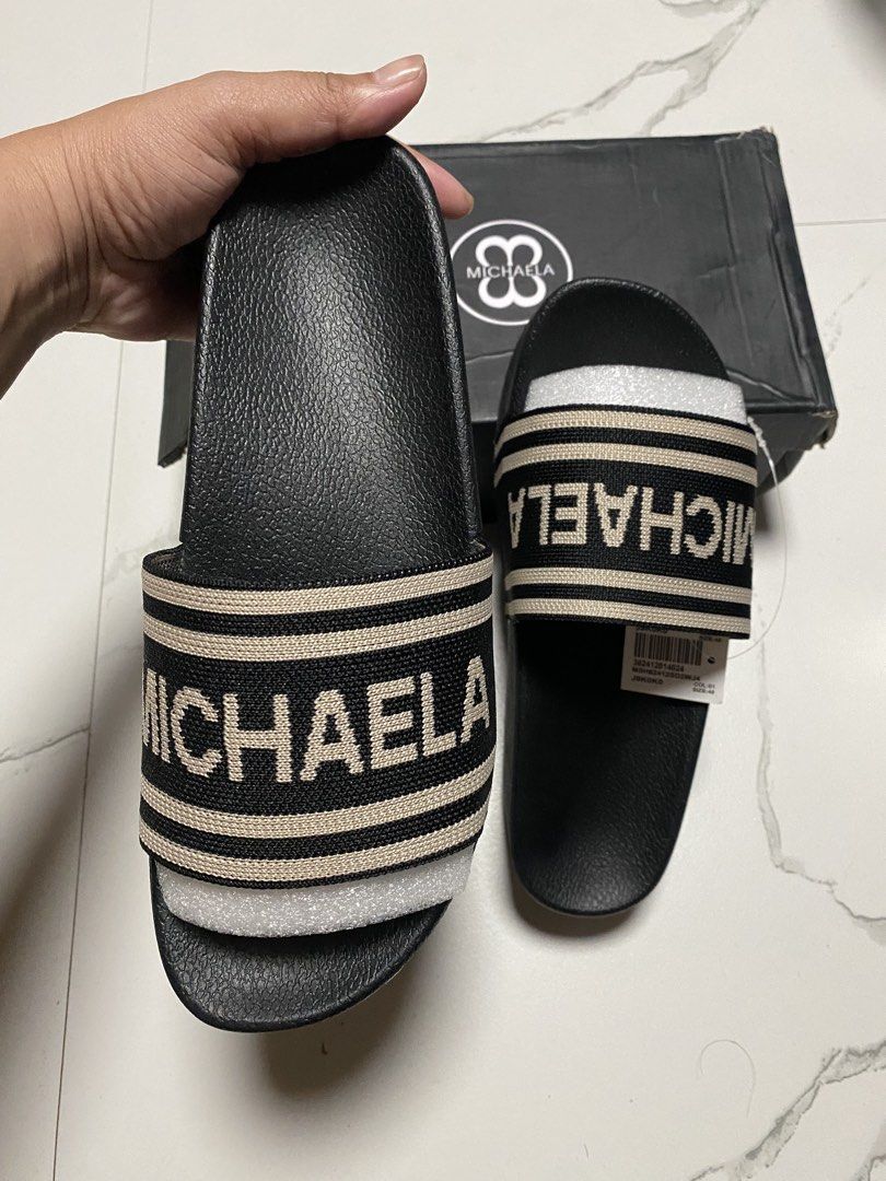 MICHAELA Black Slides with Logo Strap (Category: Slippers and slides) located in Balagtas. Submitted by dadalalashop (Listing ID 1462200106, Image 2). Description: - MICHAELA black slides - Size 40 - Features logo strap - Beige and black striped strap detail - Platform sole - Includes original box.
