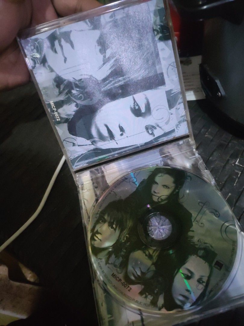 MICP-0072 CD (Category: Other Audio Equipment) located in Quezon City. Submitted by elmerbayaban304 (Listing ID 1462235489, Image 2). Description: - CD with original case included. - Features striking images of faces on both the cover art and the disc itself. - Catalog number: MICP-0072. - Please note: The case has some minor scuffs. Kindly refer to the provided photos for a closer look at the condition..