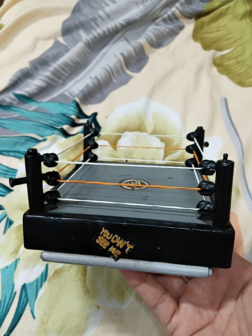 Mini Wrestling Ring (Category: Action & Battle Toys) located in Quezon City. Submitted by coffeeyuki56158 (Listing ID 1462084494, Image 2). Description: working gimicks and medyo hindi na ganun ka presentable pero wala naman chip or basag mini wrestling ring and based on my research micro aggression wrestling ring yung pinaka tawag dito , don't know kung orig or bootleg din po and brand , also nilagyan ko lang ng goma kasi yung wala na yung orig 