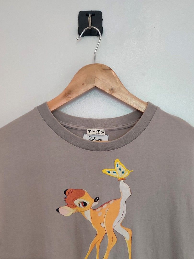 Miu Miu x Disney Bambi Tee (Category: Luxury Apparel) located in Ibajay. Submitted by trendholicrepublique (Listing ID 1462065612, Image 3). Description: Miu Miu x Disney Bambi Tee 399 Php Color Rate 9.8/10 Small On Tag (Fit to Medium) Dimes 20.5 x 26 Very Good to Excellent Condition (need wash) Issue: 1 tiny pinhole.