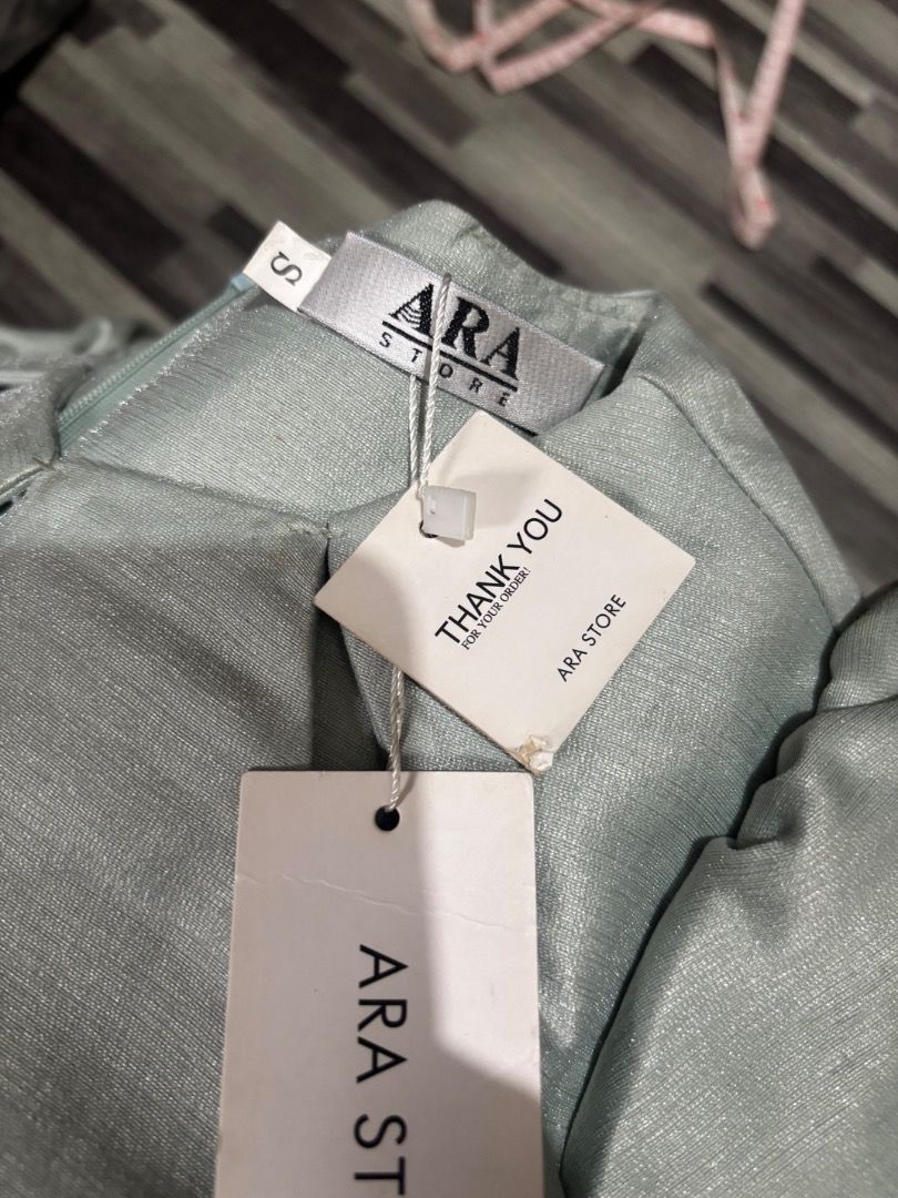 Modern Filipiniana (Category: Blouses) located in Caloocan City. Submitted by niki.niki. (Listing ID 1462154500, Image 2). Description: - Ara Storez top - Size: S - Color: Light sage green - Condition: Has a small mark on the front and a few small marks near the seam. Please check photos for details..