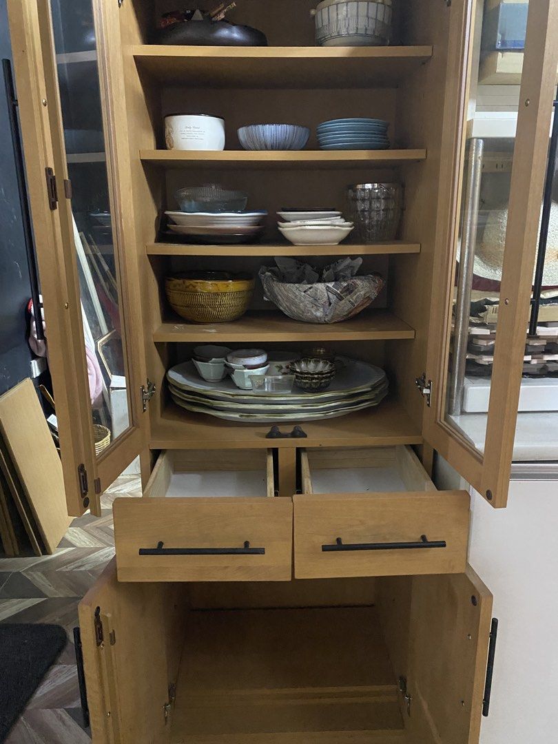 Modern Wooden Display Cabinet (Category: Shelves, Cabinets & Racks) located in Carmona. Submitted by myy_yy (Listing ID 1462145825, Image 2). Description: ✨ Features: Tall, spacious design Glass-front upper display doors Multiple interior shelves 2 large drawers Lower enclosed storage cabinet Elegant light wood finish Long black modern handles Plenty of storage space Clean, simple contemporary design 📏 Dimensions: 175cm × 60cm × 45cm 💰 Price: ₱