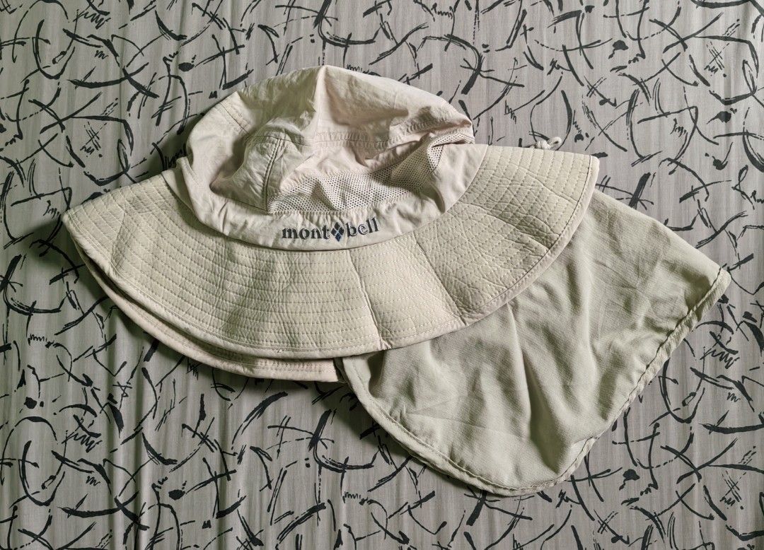 Montbell Bucket Hat with Neck Shade (Category: Caps & Hats) located in Quezon. Submitted by miksxthrift (Listing ID 1462059398, Image 2). Description: - Montbell Bucket Hat - Color: Light Beige - Size: XL - Detachable neck shade for extra sun protection - Mesh panels for enhanced ventilation - Made in Vietnam.