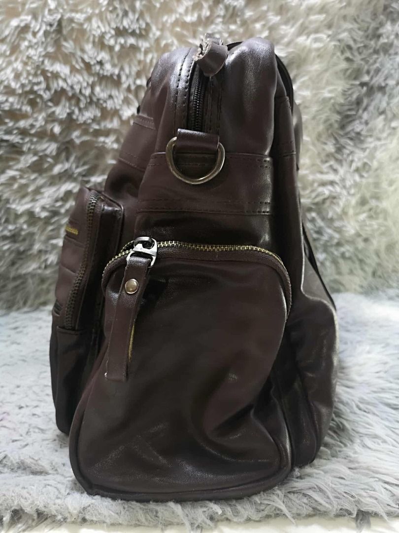 Multiple Front Zippered Pockets Leather Shoulder Bag (Category: Shoulder Bags) located in Santa Cruz. Submitted by jmy_surplus.2 (Listing ID 1462080692, Image 2). Description: Size ; L - 15 W - 17 Color ; Dark brown Type ; Shoulder bag Brand ; No brand Material ; Leather Style ; Dark brown Leather Shoulder bag LR 164 JMY 4 Batch #220.