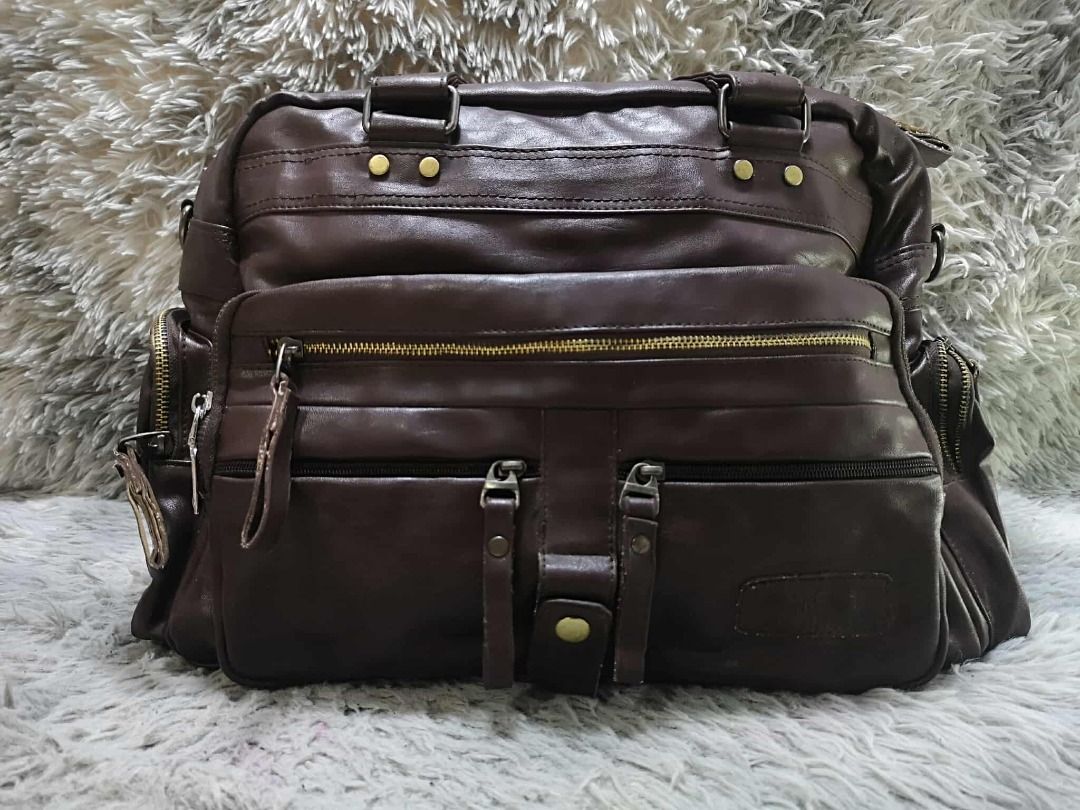 Multiple Front Zippered Pockets Leather Shoulder Bag (Category: Shoulder Bags) located in Santa Cruz. Submitted by jmy_surplus.2 (Listing ID 1462080692, Image 1). Description: Size ; L - 15 W - 17 Color ; Dark brown Type ; Shoulder bag Brand ; No brand Material ; Leather Style ; Dark brown Leather Shoulder bag LR 164 JMY 4 Batch #220.