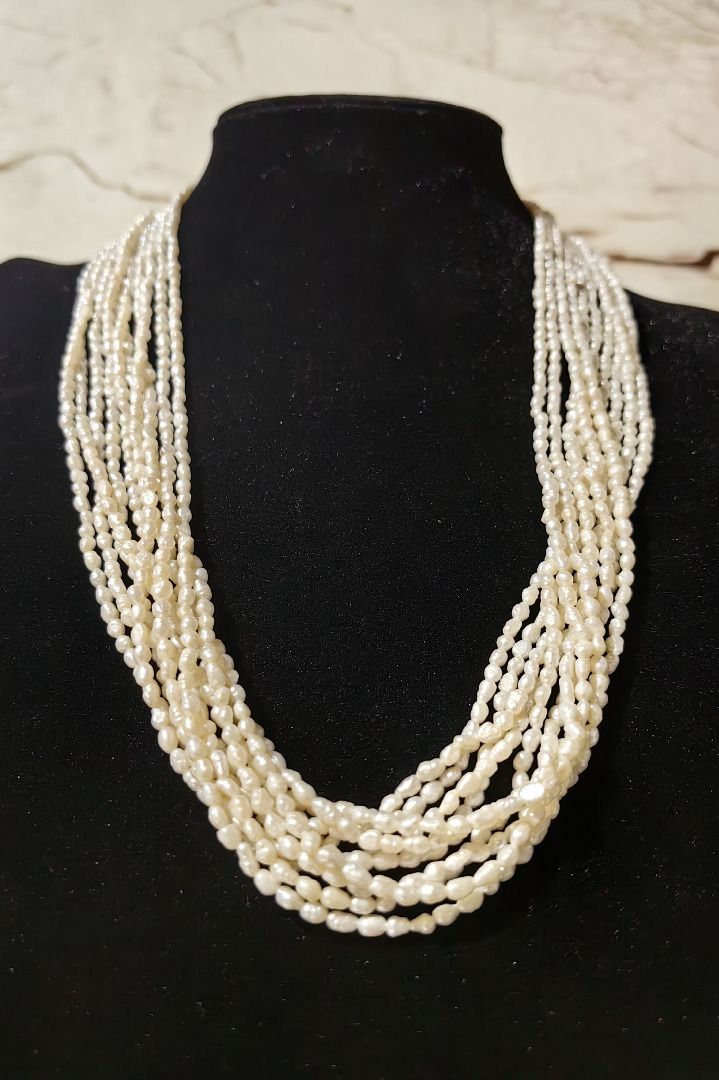 Multi-strand White Seed Pearl Necklace (Category: Necklaces) located in Caloocan City. Submitted by jeremiah.curator.2026 (Listing ID 1462258571, Image 1). Description: - Beautiful multi-strand necklace - Made of small, white seed pearls - Delicate and layered for a full look - Features natural, irregular pearl shapes for unique charm - Adds classic elegance and a subtle statement to any outfit.