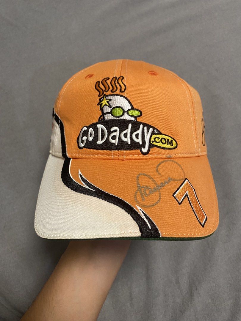 Nascar Go daddy.com Cap (Category: Caps & Hats) located in Cabuyao City. Submitted by ukaythriftshirt (Listing ID 1462250517, Image 1). Description: Nascar Go Daddy.Com Cap (With Signature) Excellent Condition Adjustable Size No hard issue sign of usage only - 450.