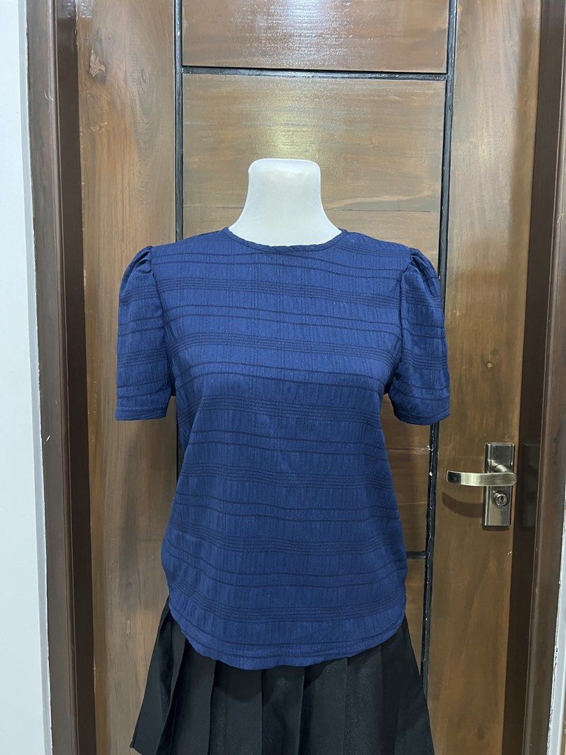 Navy Blue Puff Sleeve Top with Striped Texture (Category: Blouses) located in Angat. Submitted by yanacruise (Listing ID 1462051912, Image 2). Description: - Navy blue top - Textured horizontal stripe pattern - Short puff sleeves - Keyhole back closure with button - Versatile for casual or semi-formal occasions - Comfortable and stylish.