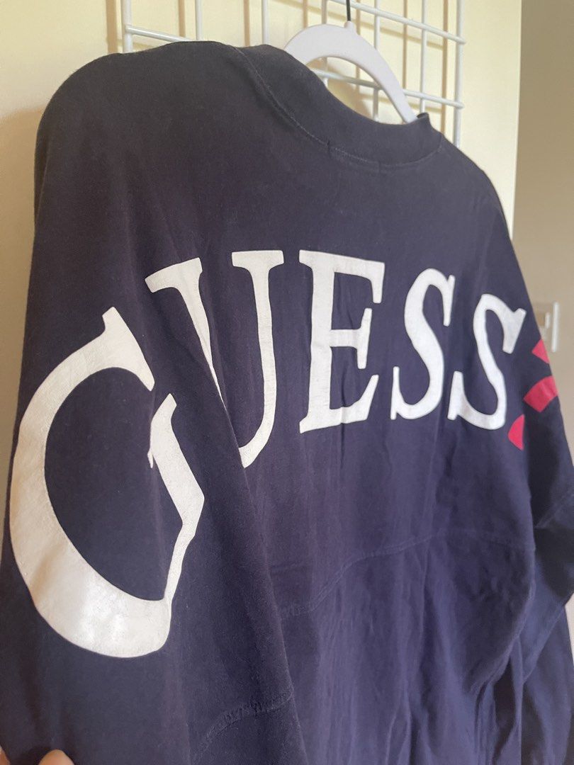 Navy GUESS Long Sleeve Shirt Size M (Category: Tshirts & Polo Shirts ) located in Cabanatuan. Submitted by jrawrrr (Listing ID 1462089541, Image 2). Description: - GUESS Navy Blue Long-Sleeved Shirt - Iconic white and red GUESS logo printed across the back - Made of 100% comfortable cotton - Perfect for casual, everyday wear -W22 L29.