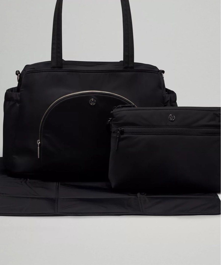 New parent tote bag 20L Lululemon (Category: Diaper Bags & Wetbags) located in San Juan City. Submitted by rlcaps (Listing ID 1462065836, Image 1). Description: - Black Lululemon diaper bag set -Brand new - Includes main bag, smaller pouch, and foldable changing pad - Multiple pockets inside and out for excellent organization - Features adjustable shoulder strap and top handles - Ideal for parents needing a functional bag on the go.