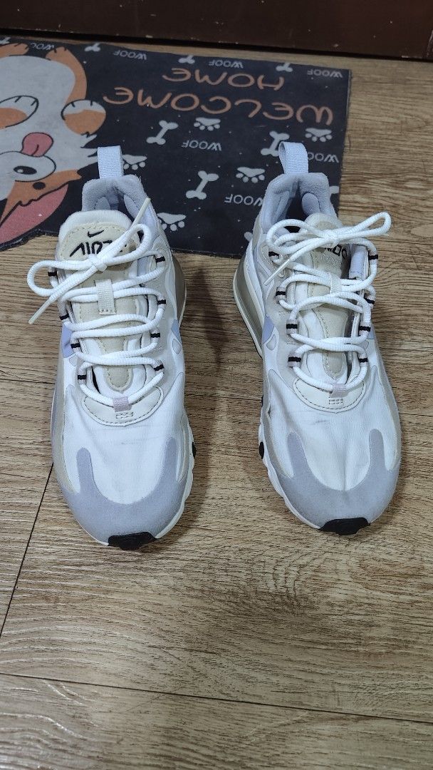 Nike Air Max 270 React White Grey Sneakers (Category: Sneakers) located in Manila. Submitted by lasampana50217 (Listing ID 1462117793, Image 1). Description: - Nike Air Max 270 React - Color: White and Grey -great condition, air bubble is very good -Size 5 womens - Signature React foam and Air Max cushioning for ultimate comfort - Stylish design perfect for everyday wear - Versatile: Great for running or casual outings - White laces.