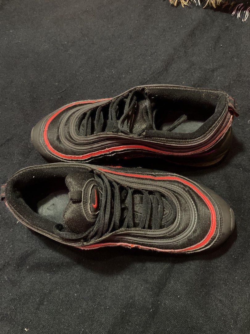 Nike Air Max 97 Black Red Men's US 9.5(Authenticated) (Category: Sneakers) located in Cagayan de Oro. Submitted by chabermz (Listing ID 1462225650, Image 2). Description: - Nike Air Max 97 - Color: Black with Red Accents - Size: US 9.5/ Euro 43 - Condition: Shows some signs of wear on soles and upper, but plenty of life left. - Ideal for: Casual wear.