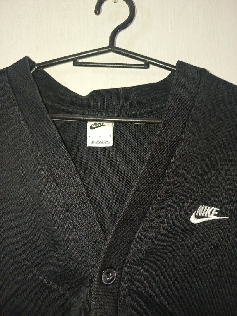 Nike Black Cardigan Size L (Category: Coats, Jackets and Outerwear) located in Pasig City. Submitted by atmclick (Listing ID 1462107941, Image 2). Description: - Black Nike cardigan - Size L - Dimes 22x29 - Embroidered Nike logo on chest - Button-up front - Made in Pakistan - Ideal for layering or wearing solo.