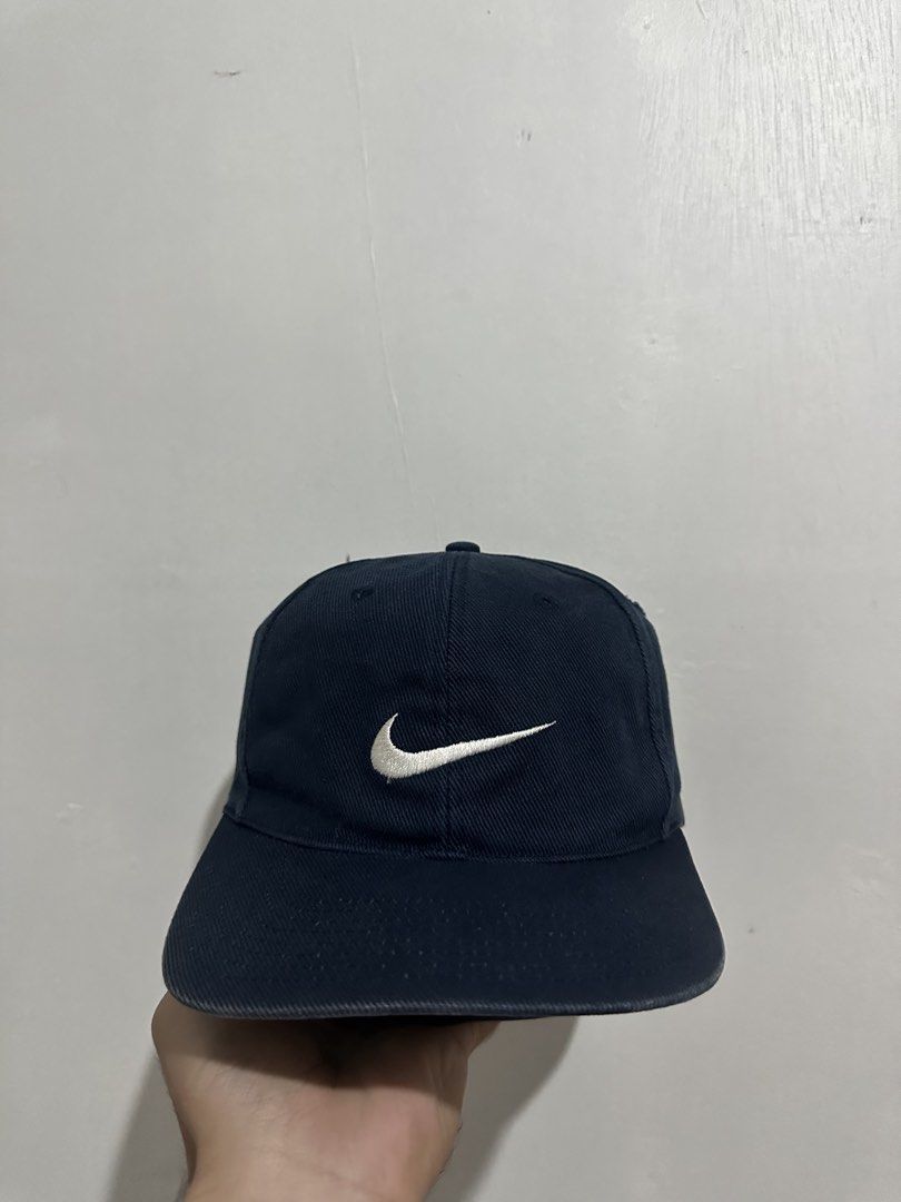 Nike Cap Navy Blue Embroidered Swoosh (Category: Caps & Hats) located in Digos. Submitted by ken18_hawk (Listing ID 1462048993, Image 2). Description: vintage 90s nike no issues good condition excellent condition color rate 9/10 dm to purchase .