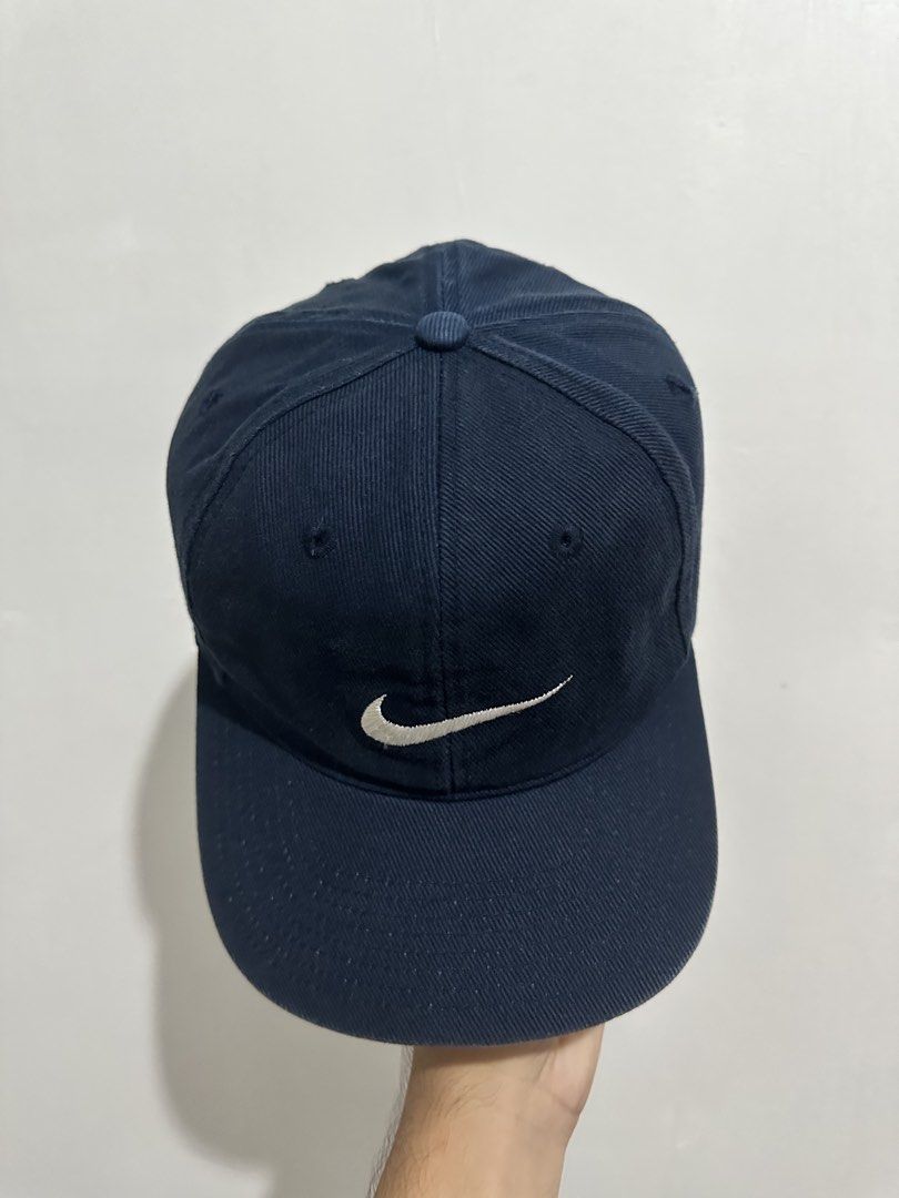 Nike Cap Navy Blue Embroidered Swoosh (Category: Caps & Hats) located in Digos. Submitted by ken18_hawk (Listing ID 1462048993, Image 1). Description: vintage 90s nike no issues good condition excellent condition color rate 9/10 dm to purchase .